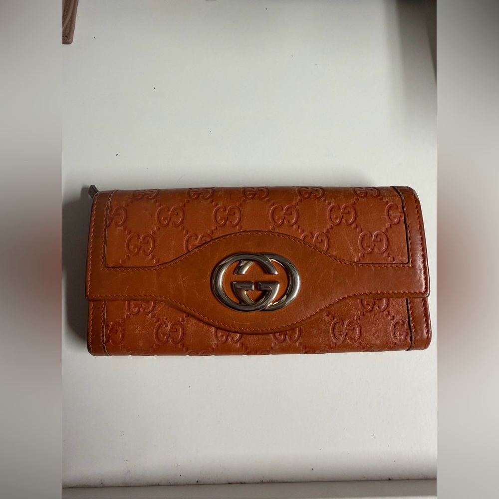 Gucci Brown Embossed Leather Continental Wallet with Double G Hardware.
